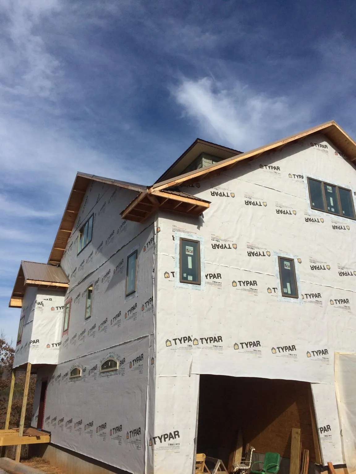 Stick built house wrapped in Typar with new roof framing and dormers in Berry Creek